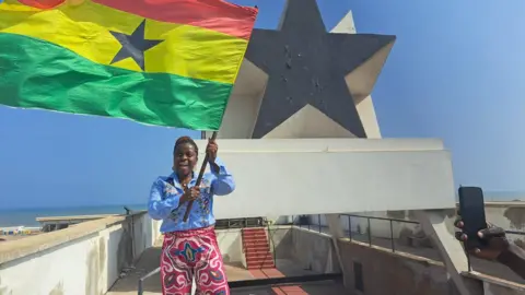 Courtesy of Linda Gyamfi Ms Gyamfi flying Ghana's flag at Independence Square in Osu, Accra