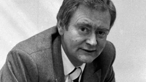Alamy Black and white photo of David Scott in a suit from 1981