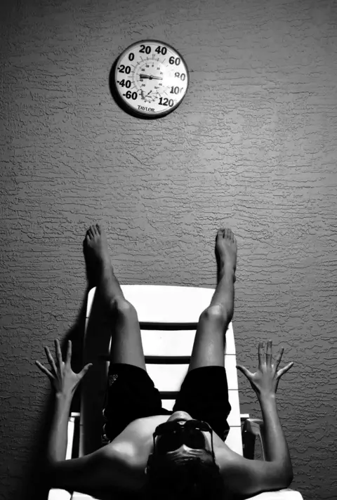 Kitty Castledine A boy lies on a chair