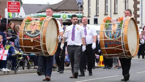 Pacemaker Orangemen playing lambeg drums at the Twelfth parade in Ballyclare
