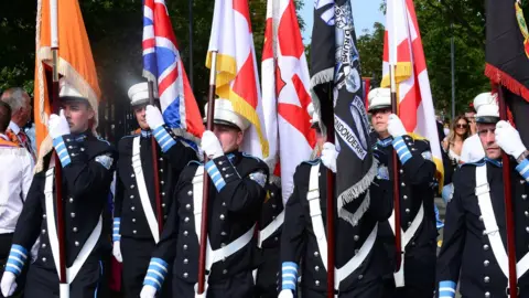 Pacemaker Flag bearers marching at the Twelfth parade in Newtownards