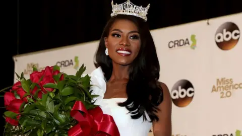 Getty Images Miss New York wearing her crown with flowers