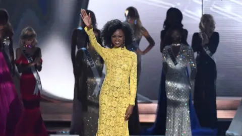 Getty Images Deshauna Barber on stage with her natural hair