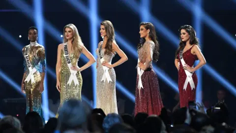 Getty Images The top five Miss Universe contestants - including Zozibini Tunzi - on stage