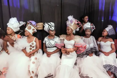 AFP Traditionally clad queens from various provinces of South Africa take part in the Miss Indoni SA section of the three-day Indoni Cultural Festival.