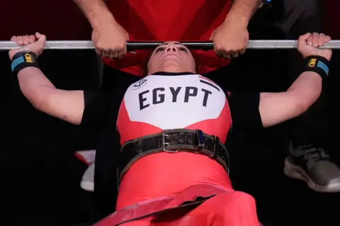 Getty Images Gihan Abdelaziz of Team Egypt competes during the women's -55 kg Powerlifting final on day 3 of the Tokyo 2020 Paralympic Games at on August 27, 2021