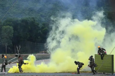 EPA Military personnel from Mali take part in the "Emergency Area" competition round at the Mieu Mon National Training Center in Hanoi, Vietnam, 31 August 2021,
