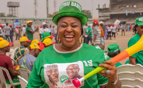 Grace Ekpu/BBC Woman wearing a hat that says Atiku Babes