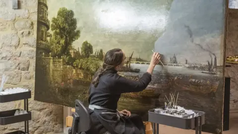 National Trust/James Dobson A woman removing varnish from The Embarkation of George IV from Whitehall: the Opening of Waterloo Bridge, 1817, by John Constable