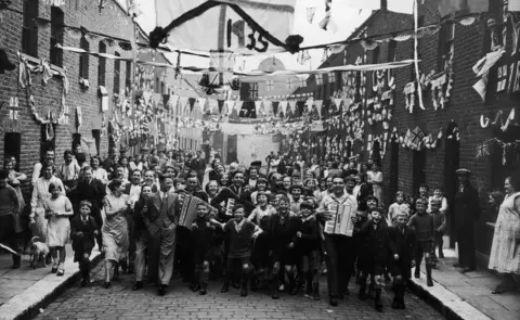 Getty Images 5th May 1935: Residents of Dudley Street, Paddington, London, at the start of their jubilee festivities in honour of King George V.
