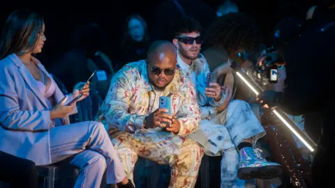 Getty Images People watching the South African Fashion Week Spring/Summer 2022 Collection, Johannesburg, South Africa - Friday 29 April 2022