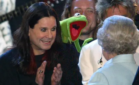 Getty Images The Queen is introduced to Ozzy Osbourne and Kermit the Frog on stage during "Party at the Palace" in London 03 June 2002