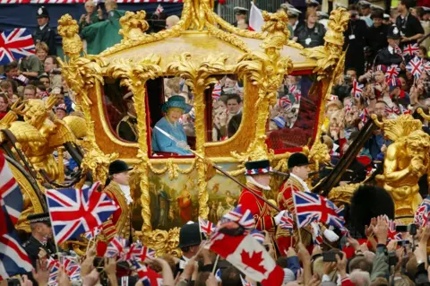 Getty Images Queen Elizabeth (R) and Prince Philip ride in the Golden State Carriage at the head of a parade from Buckingham Palace to St Paul's Cathedral celebrating the Queen's Golden Jubilee June 4, 2002
