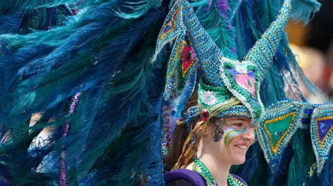 PA Media Performers from Edinburgh Festival Carnival parade entertain the crowds in Princes Street Gardens in Edinburgh during a Platinum Jubilee event on day four of the Platinum Jubilee celebrations.