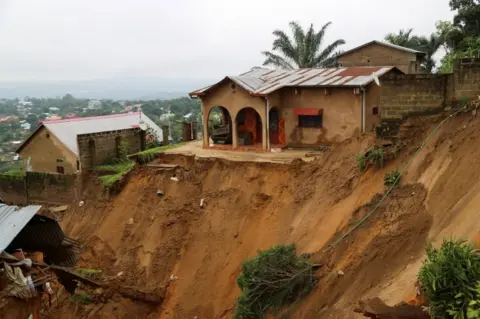 Reuters A whole in the hillside is seen where the landslide happened.