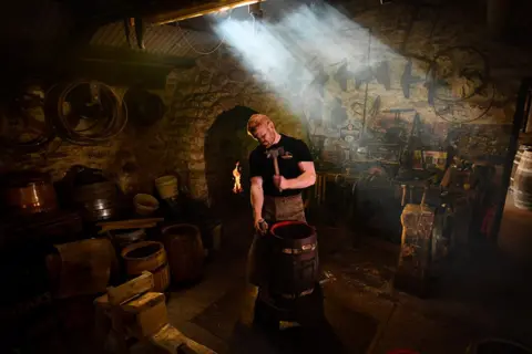 Simon Hulme Journeyman cooper Euan Findlay, pictured in the cooperage at Theakston Brewery, Masham in North Yorkshire, 28 September 2022