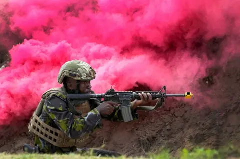 Brian Inganga/Reuters A soldier holds a rifle during a presentation at Mtongwe Naval Base in Mombasa - 2 November 2023