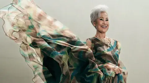 Franchely Figueroa Choi Soon-hwa poses for the camera in a flowing dress