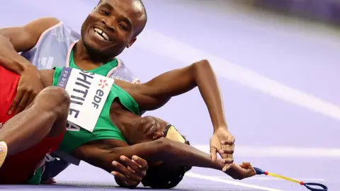 Franck Fife / AFP Namibia's Lahja Ishitile collapsed on the racetrack alongside her guide Sem Shimanda after winning the Women's 400m T11 Final at the Paris Paralympic Games - Saturday 31 August 2024