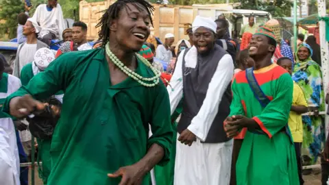 AFP A Sufi Muslim wearing green performs a traditional dance during a festival commemorating the birth of Islam's Prophet Muhammed in Gadaref, Sudan - Wednesday 4 September 2024.