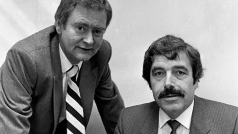 Alamy David Scott and Jimmy Reid sitting in an office