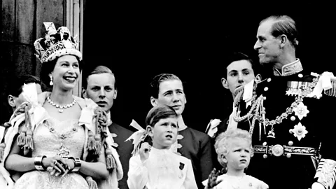 Queen Elizabeth II and the Duke of Edinburgh stand on the balcony at Buckingham Palace after the Queen's Coronation in 1953. (PA Wire)