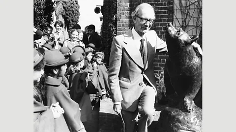 Keystone/Hulton Archive/Getty Christopher Robin Milne unveils a statue of a bear at London Zoo in 1981 (Credit: Keystone/Hulton Archive/Getty)