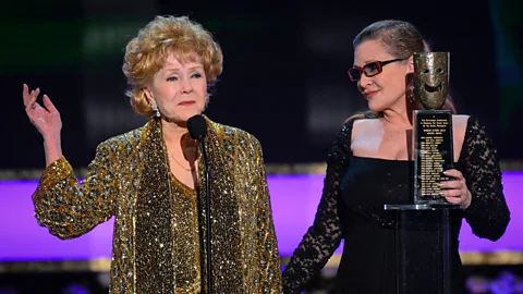 Alamy Debbie Reynolds and Carrie Fisher became very close in their last years – Fisher even presented her mother with her Screen Actors Guild Lifetime Achievement honor (Credit: Alamy)