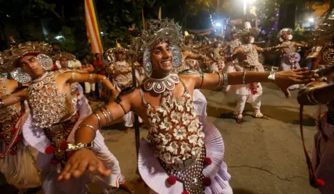 Dinuka Liyanawatte/ Reuters Sri Lankan traditional dancers perform during the annual Navam Perahera.