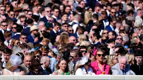 PA Media A crowd shot of racegoers on day three of the Randox Grand National Festival at Aintree Racecourse, Liverpool.
