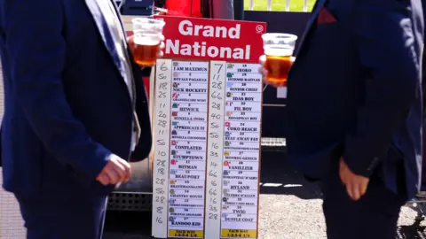 PA Media A board listing the runners of the Grand National on day three of the Randox Grand National Festival at Aintree Racecourse, Liverpool.