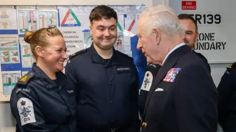 Getty Images King Charles meets a servicewoman on the HMS Prince of Wales